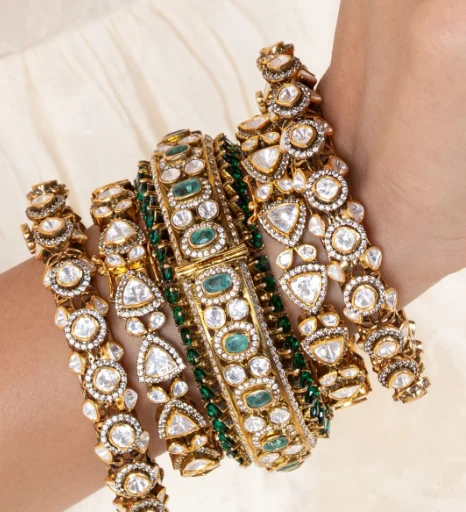 Emerald and kundan bangles worn on the wrist